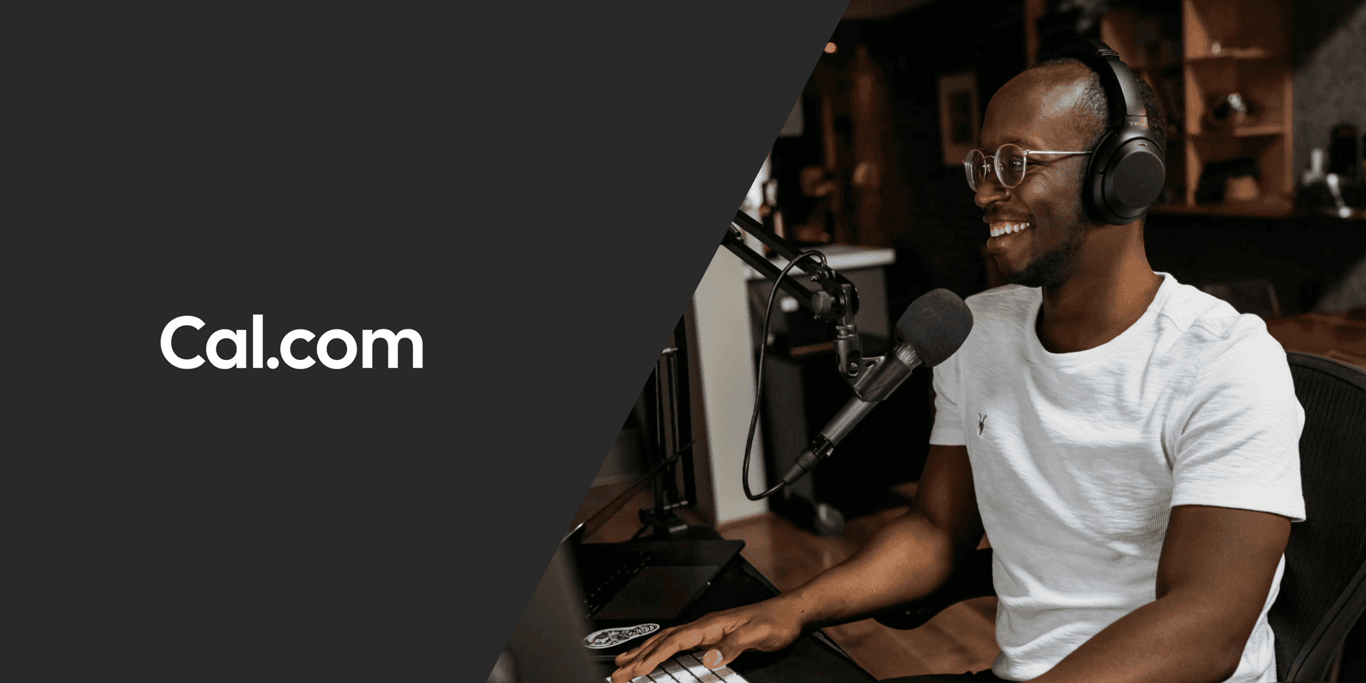 Podcaster recording at a desk with microphone and headphones