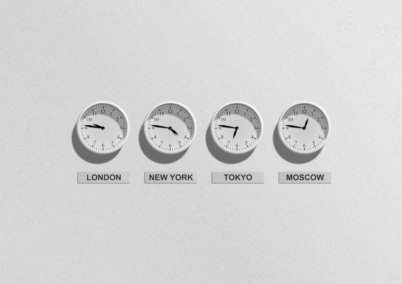 Wall clocks showing time zones for London, New York, Tokyo and Moscow
