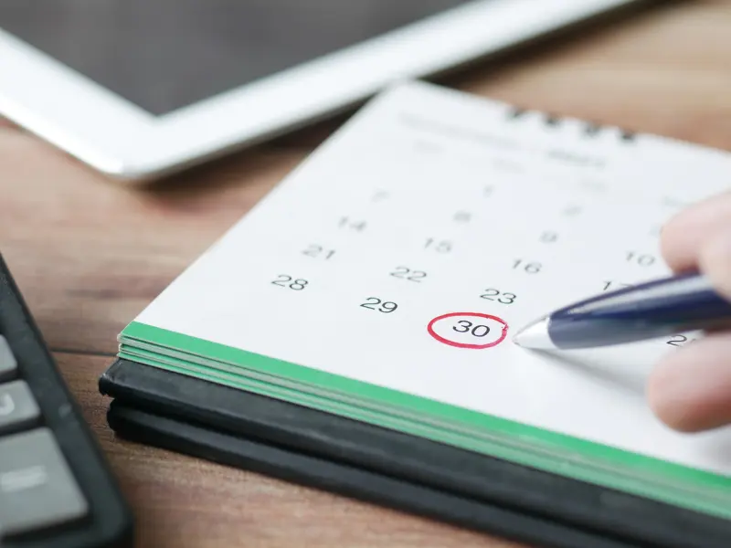 Smart calendar buffers illustrated by a marked date circled in red on a desktop calendar