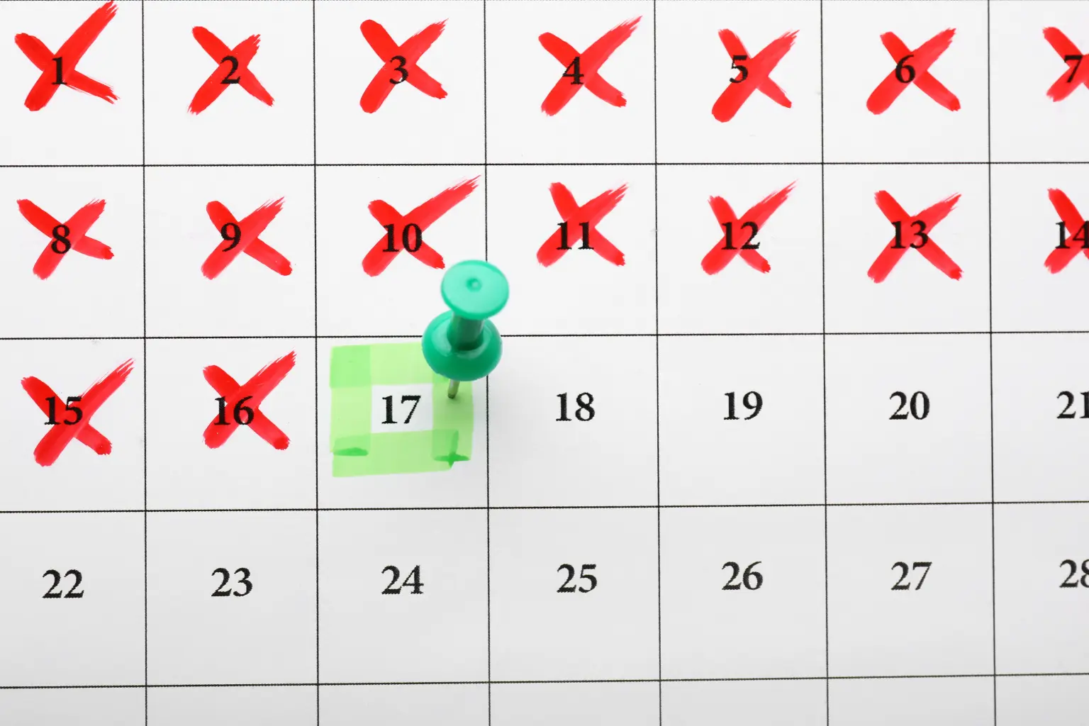 Calendar page with days crossed out in red