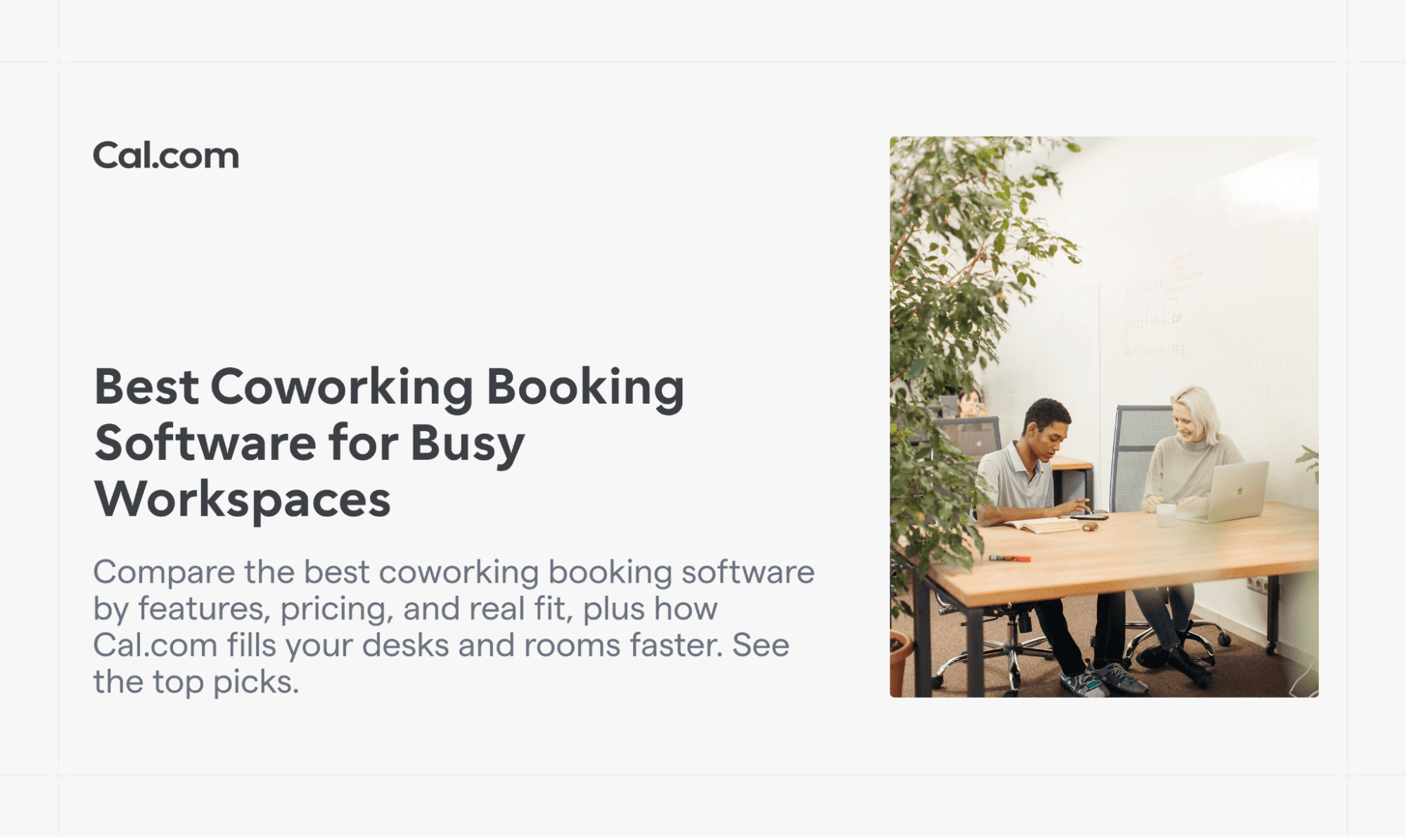 Two coworkers talking at a coworking desk