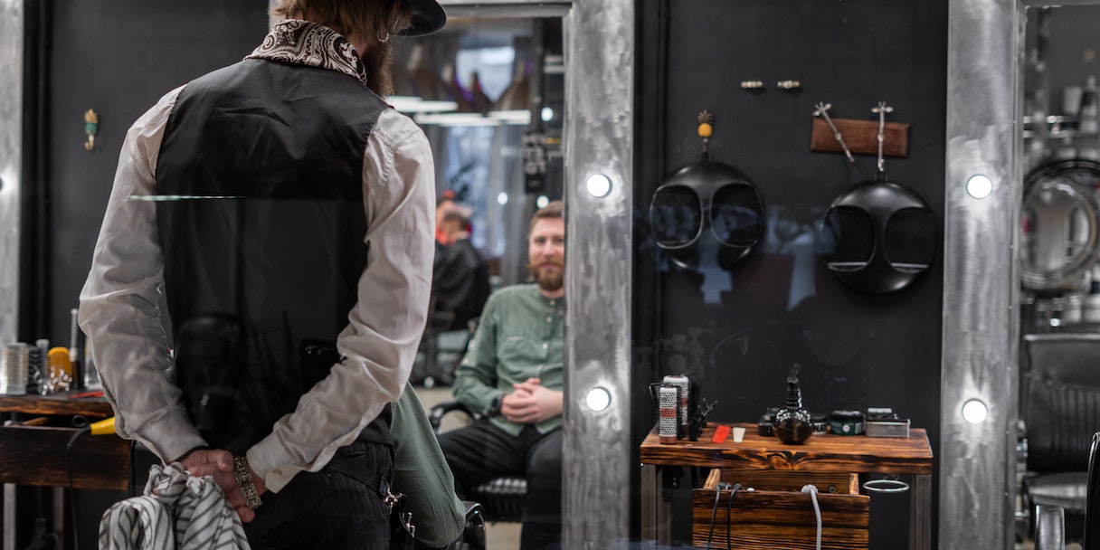 Barber shop interior with client in mirror reflection