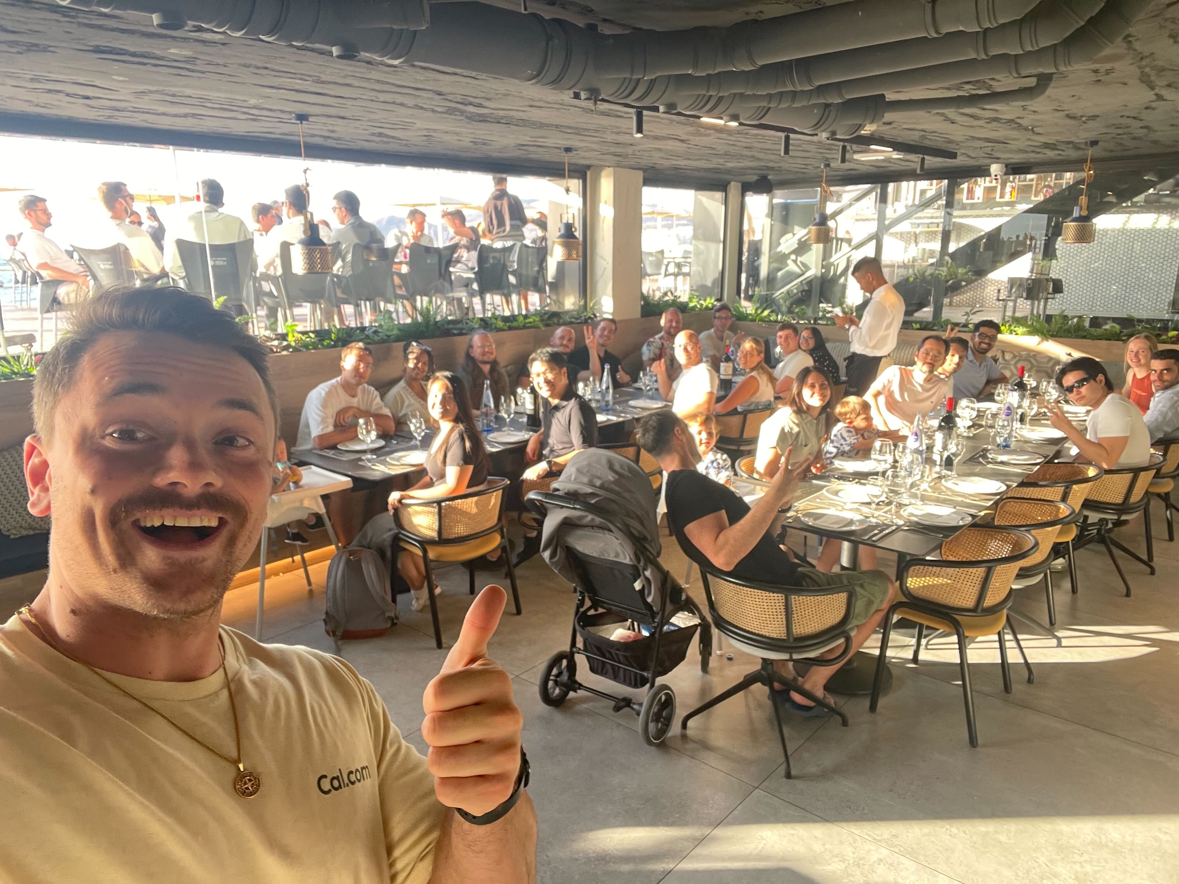 Team photo at outdoor restaurant meetup