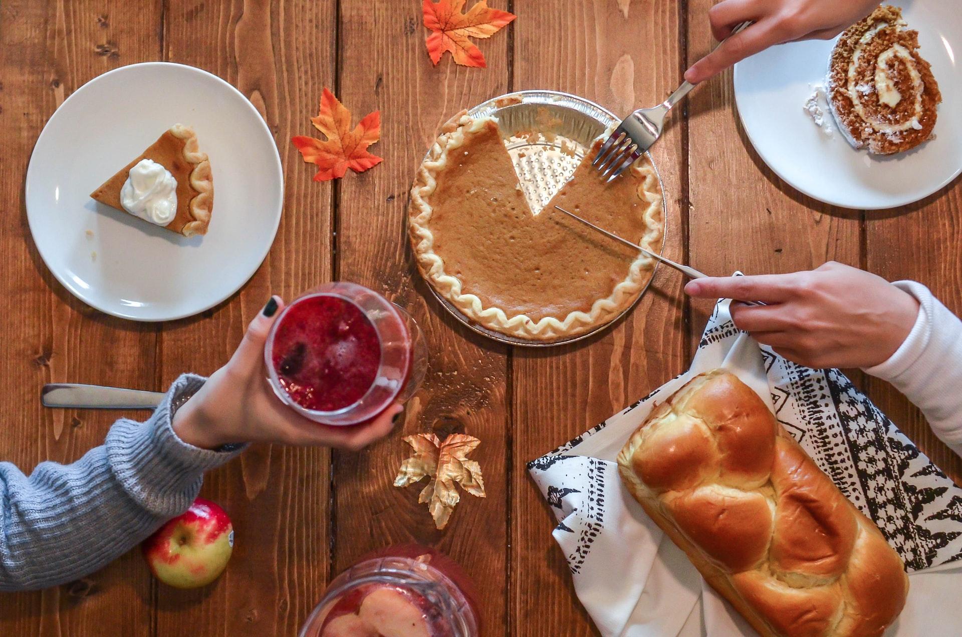 Overhead shot of pumpkin pie and holiday desserts on table