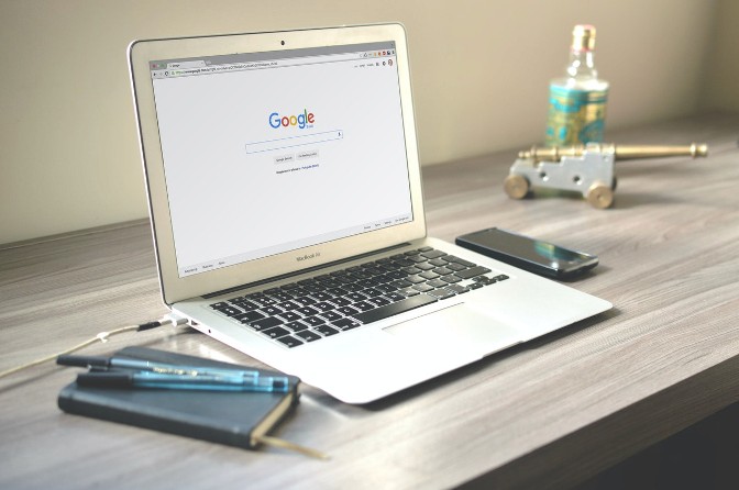 Laptop displaying the Google search homepage