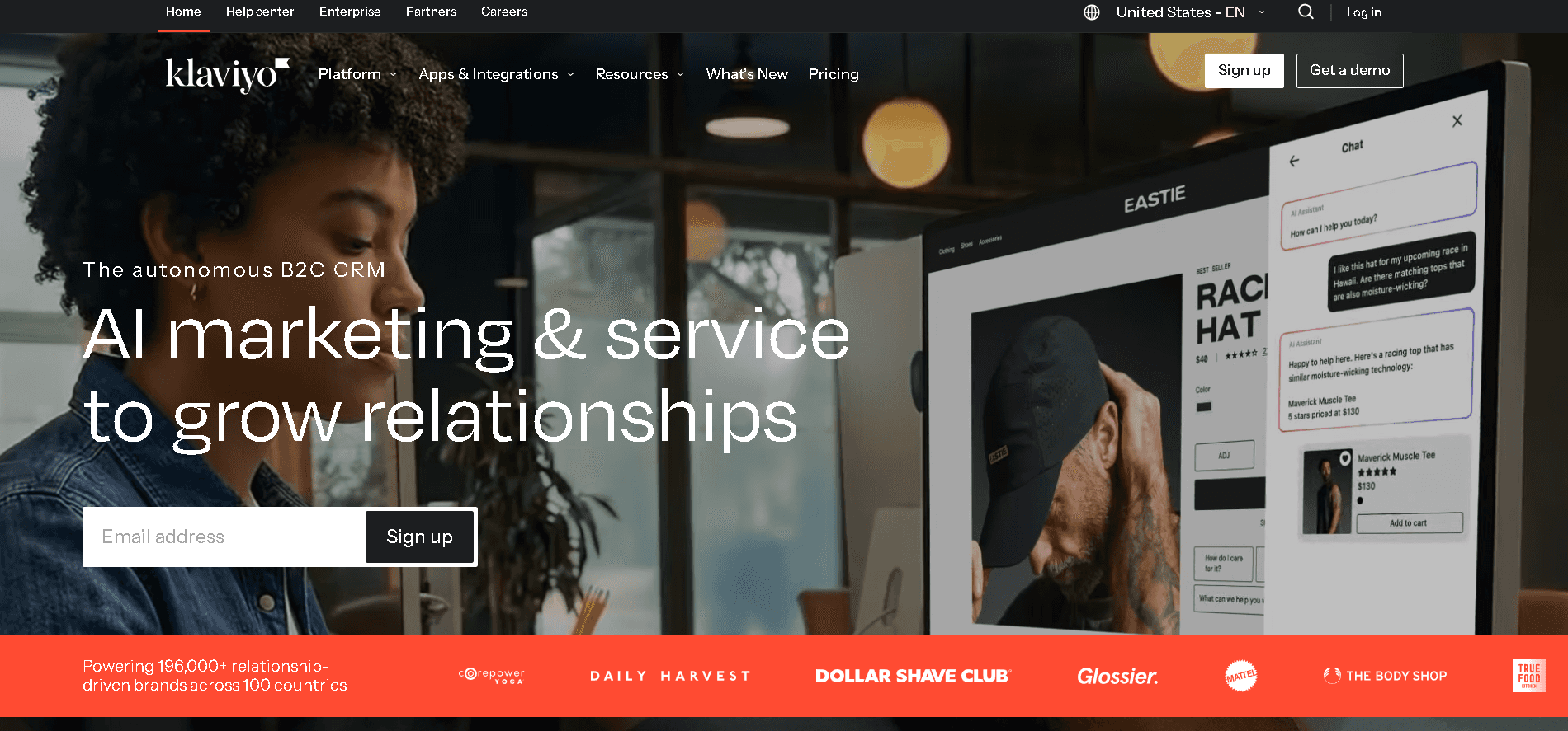 Klaviyo e-commerce marketing automation homepage showcasing B2C CRM software features, email signup fields, and retail brand logos.