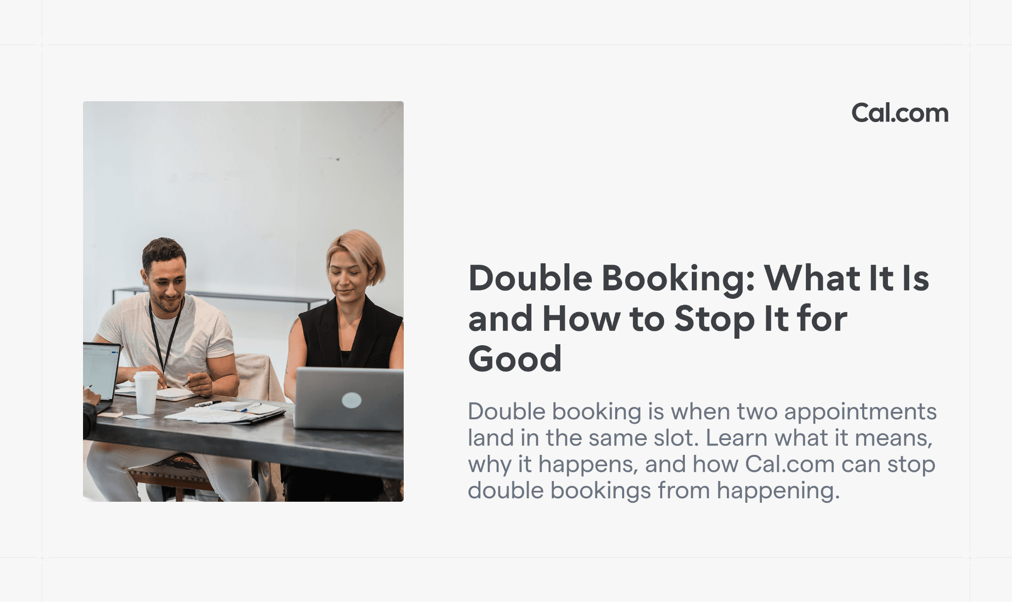 Man and woman smiling together at a desk