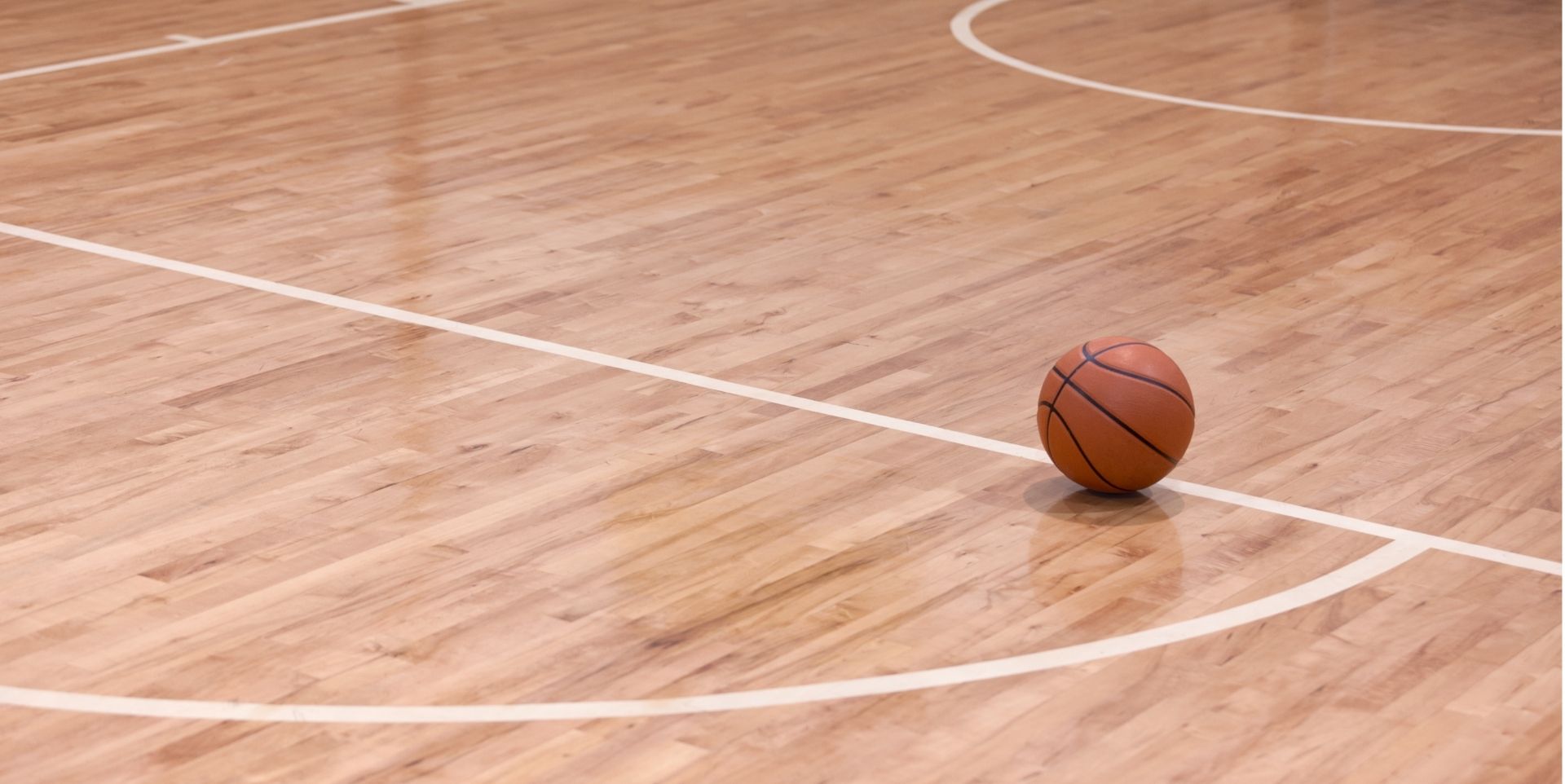 Basketball resting on an indoor court