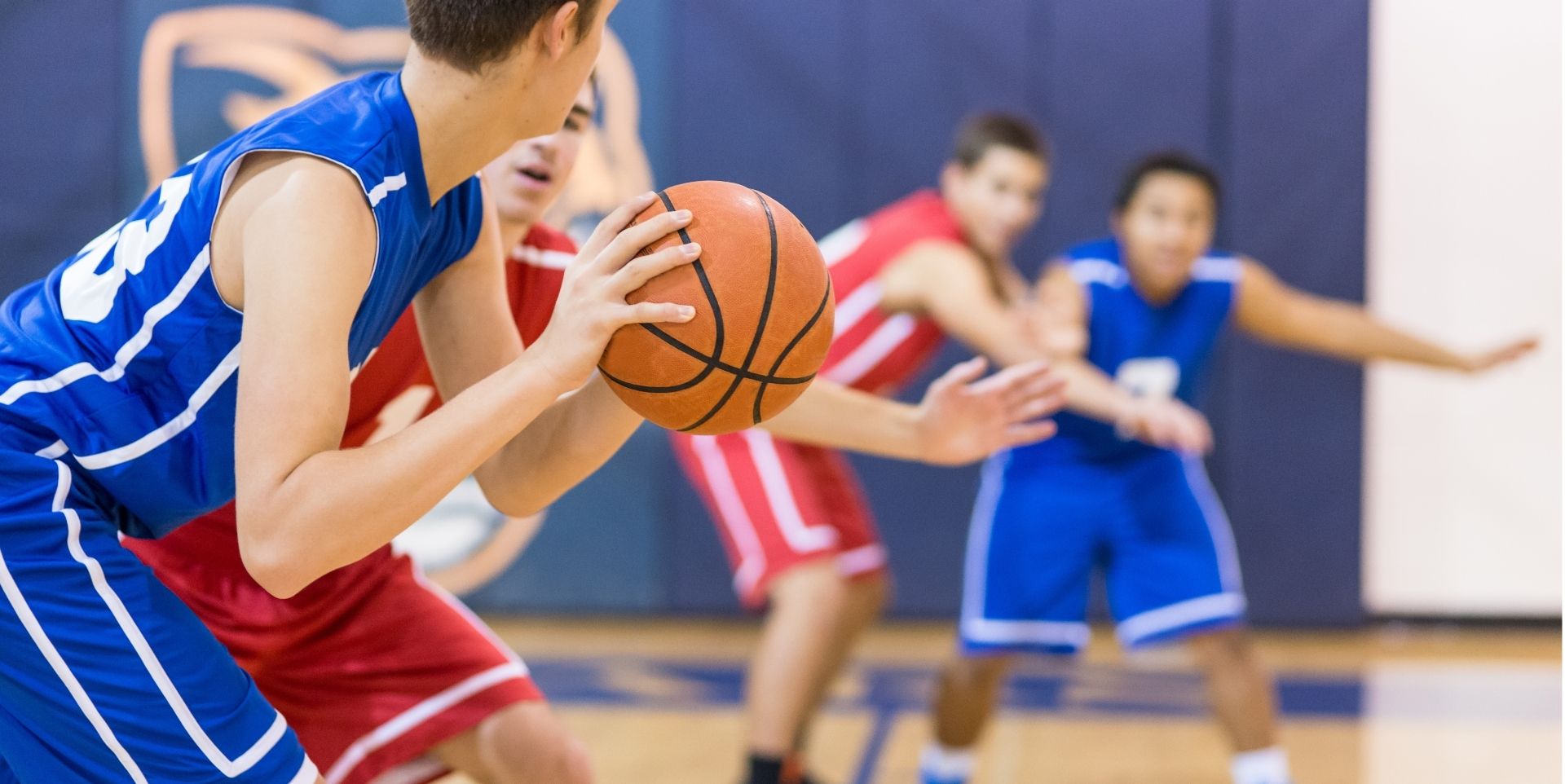 Youth basketball players competing on the court