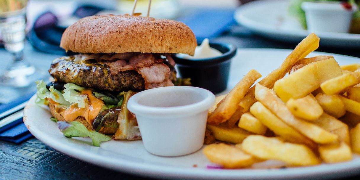 Burger and fries on a restaurant plate
