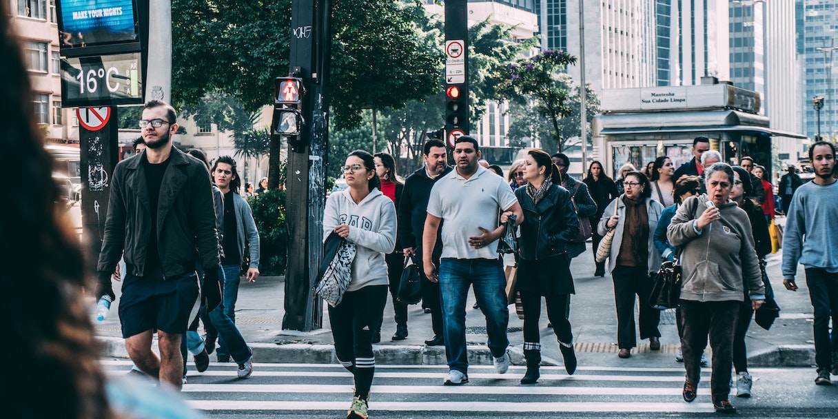 Pedestrians crossing a busy city street