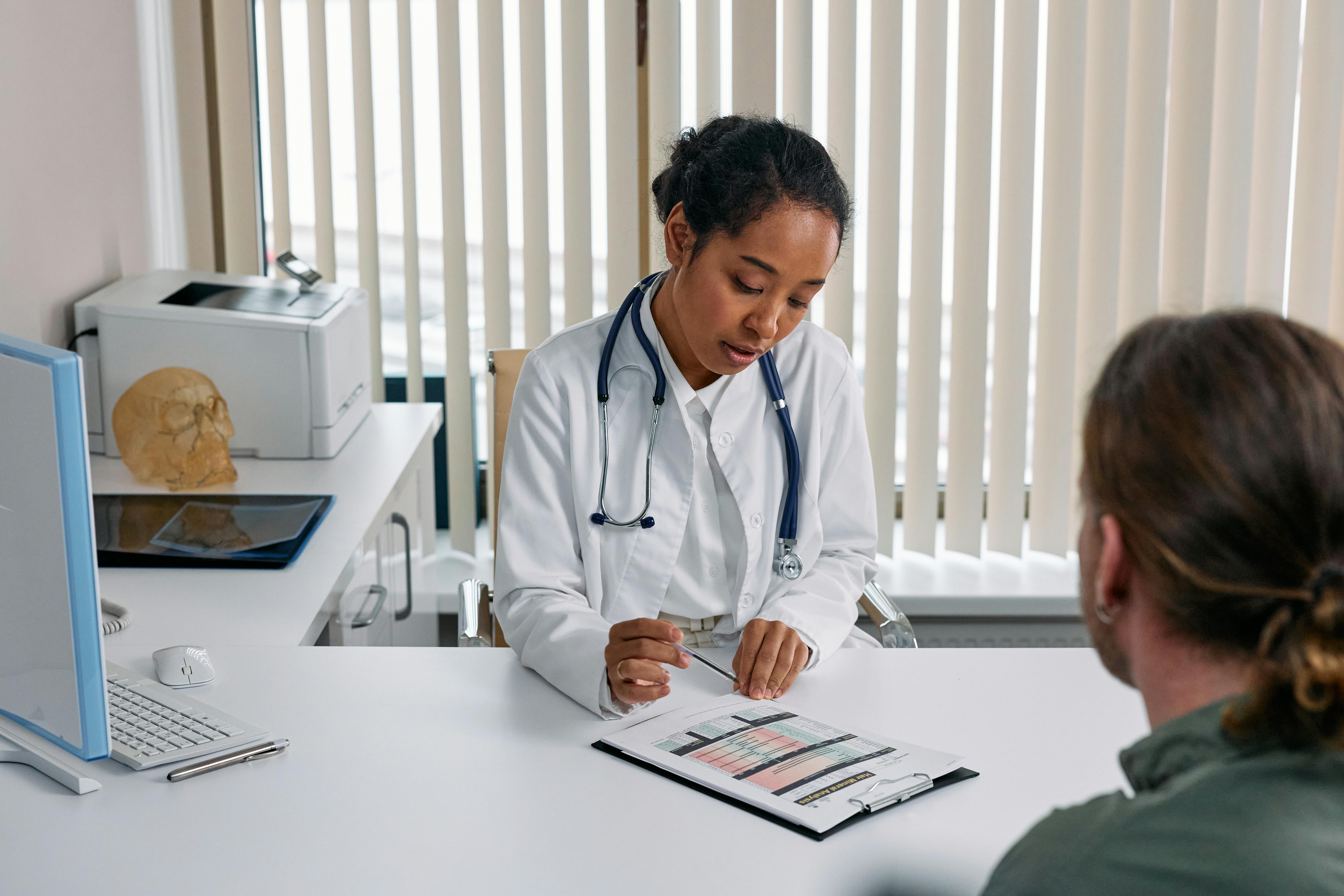 Doctor reviewing a chart with a patient