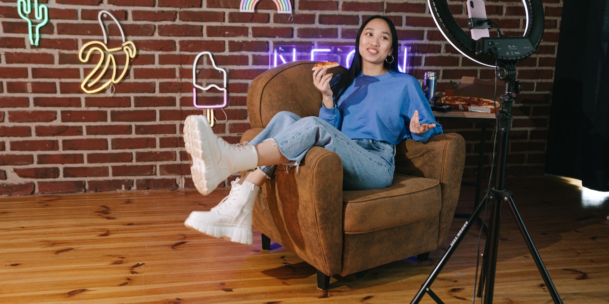 Content creator filming with a ring light setup
