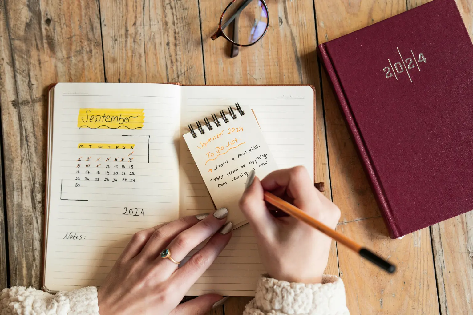 Notebook with September calendar and handwritten notes