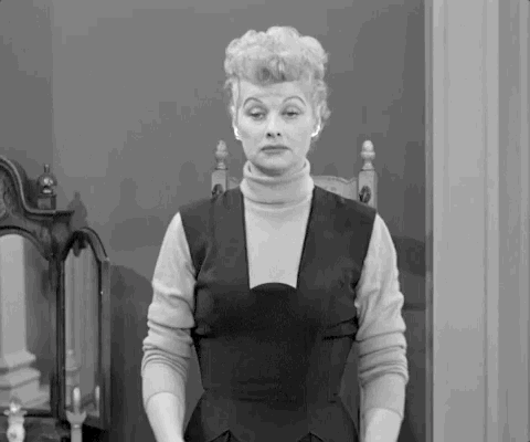 Black and white still of a woman with styled hair