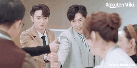 Drama still of two men fist-bumping, Rakuten Viki
