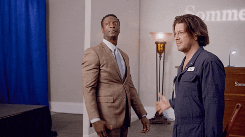 Two men in a comedic conversation scene