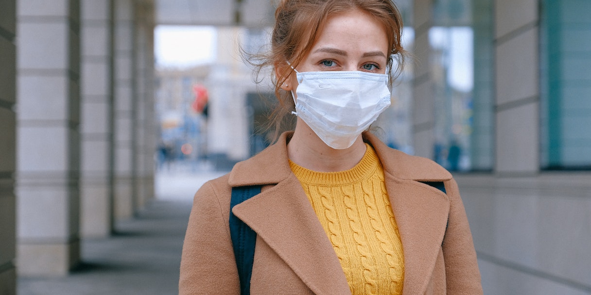 Woman wearing a face mask outdoors