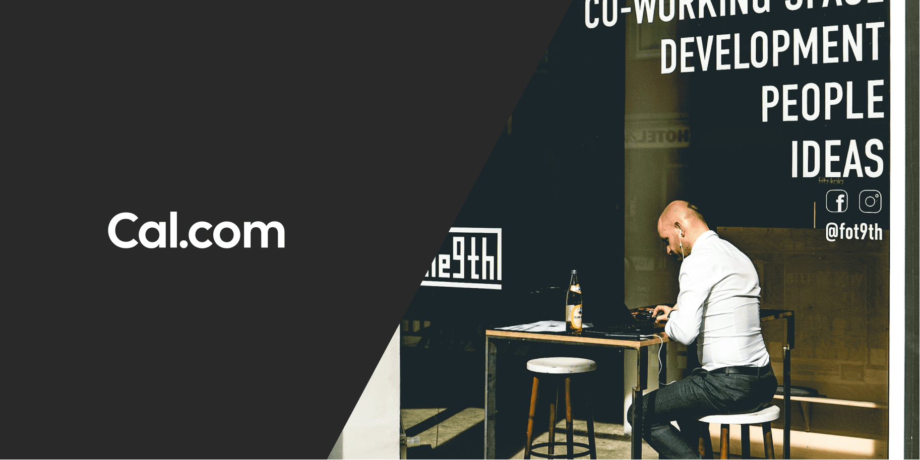 Man working at a laptop in a coworking cafe