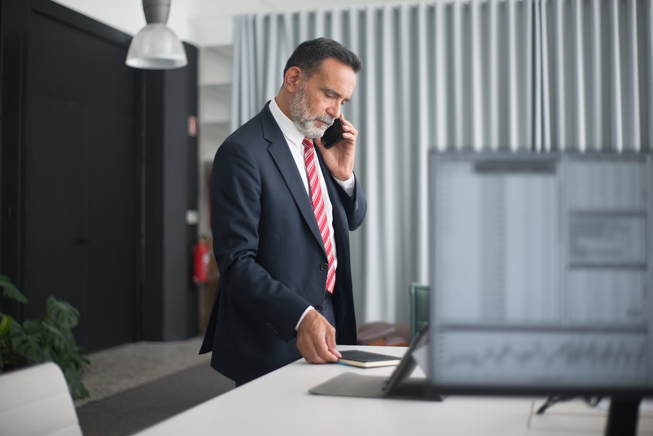 Businessman on the phone at an office desk