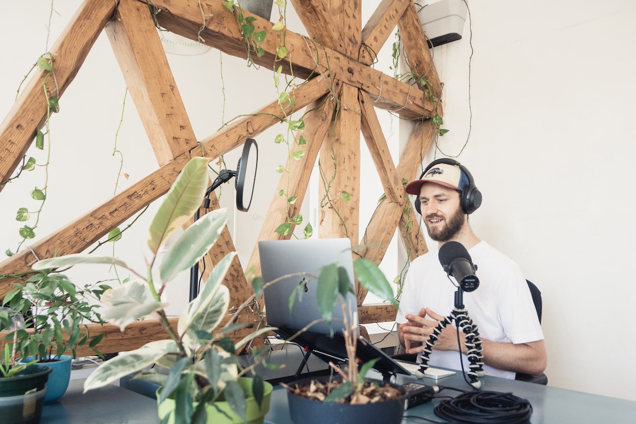 Man recording a podcast at his desk