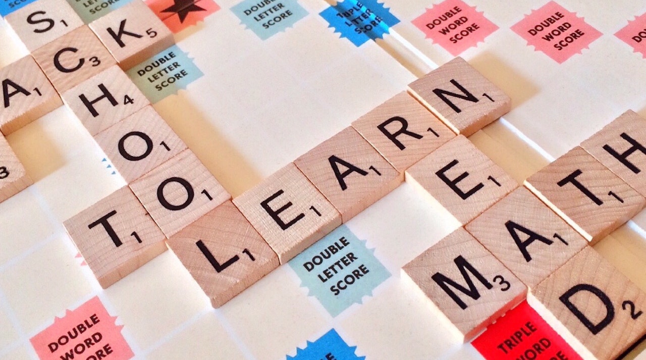 Scrabble tiles spelling back to learn math