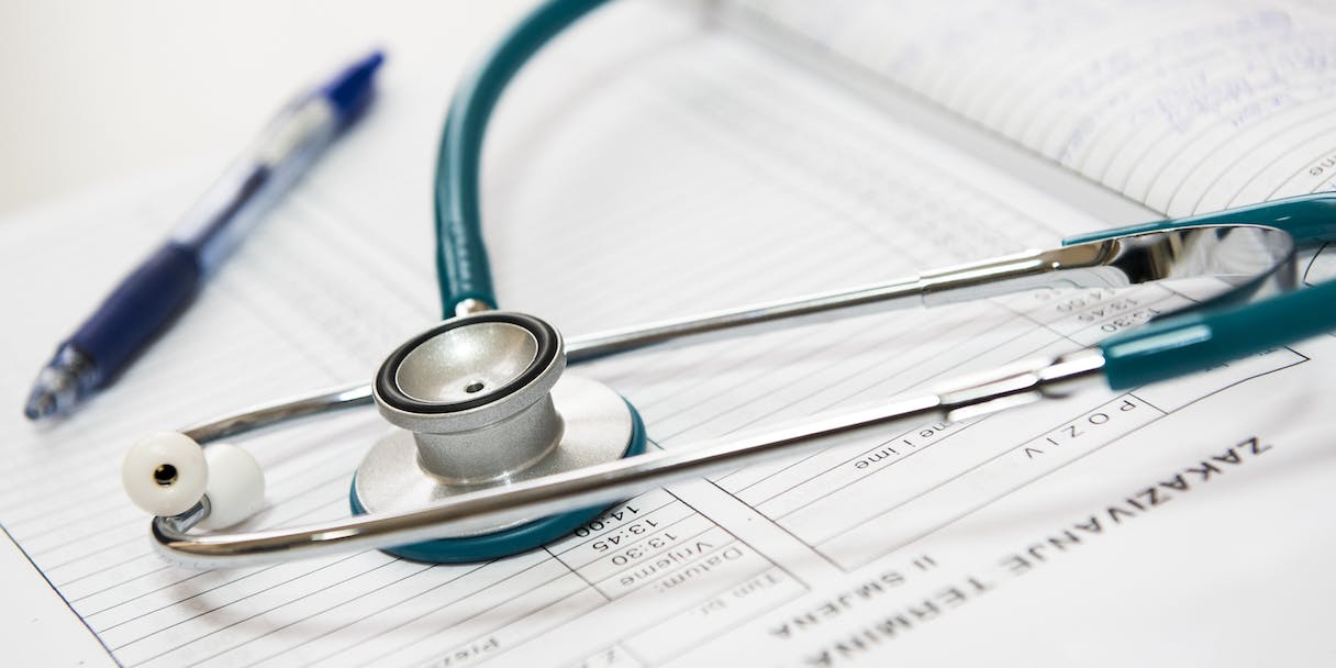 Stethoscope resting on a medical appointment form