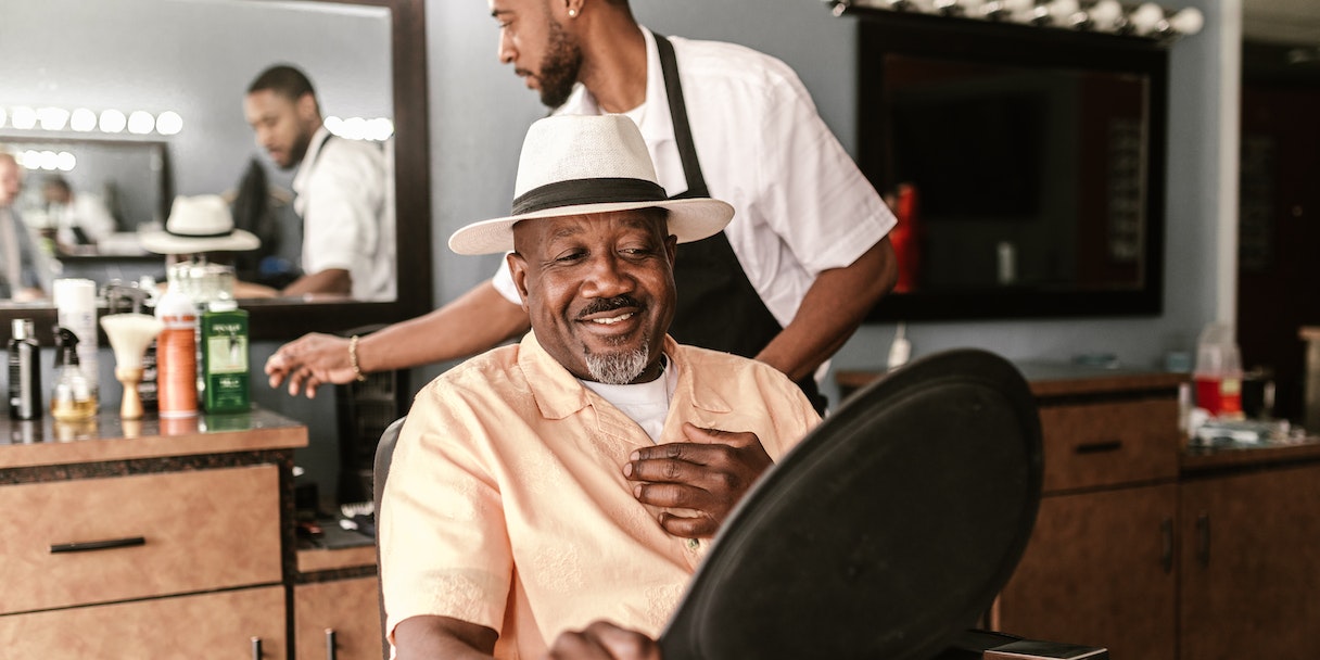 Smiling customer in a barber chair