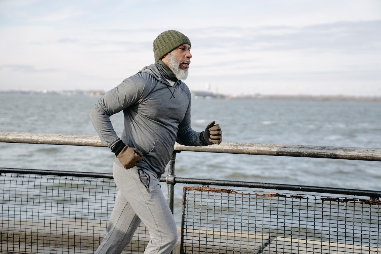 Man jogging along a waterfront path