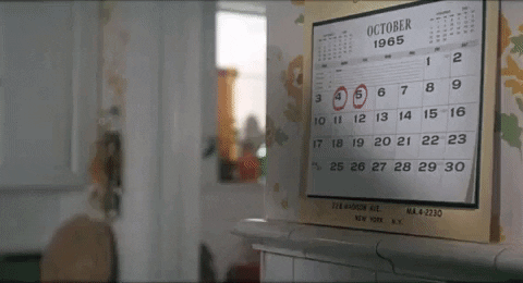 Movie still of a 1965 wall calendar with circled dates