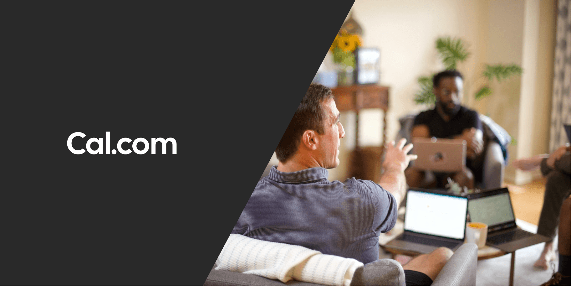People relaxing on a couch with laptops