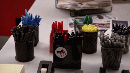 Pen holders on an office desk