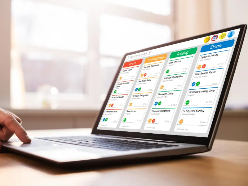 Open-source calendar scheduler displayed on a laptop screen showing task columns for project management.
