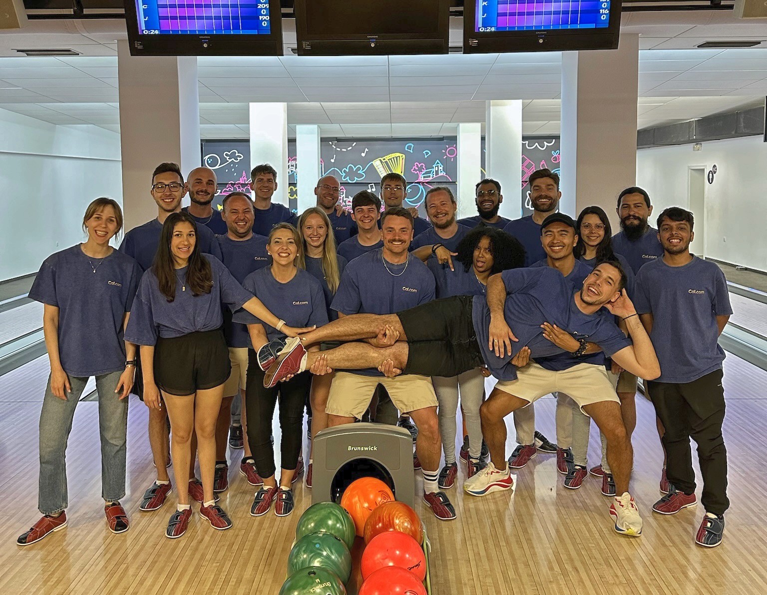 Group photo of a team at a bowling alley